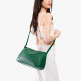 Bacalar Medium | Model wearing a leather Crossbody with a flap and magnetic closure
