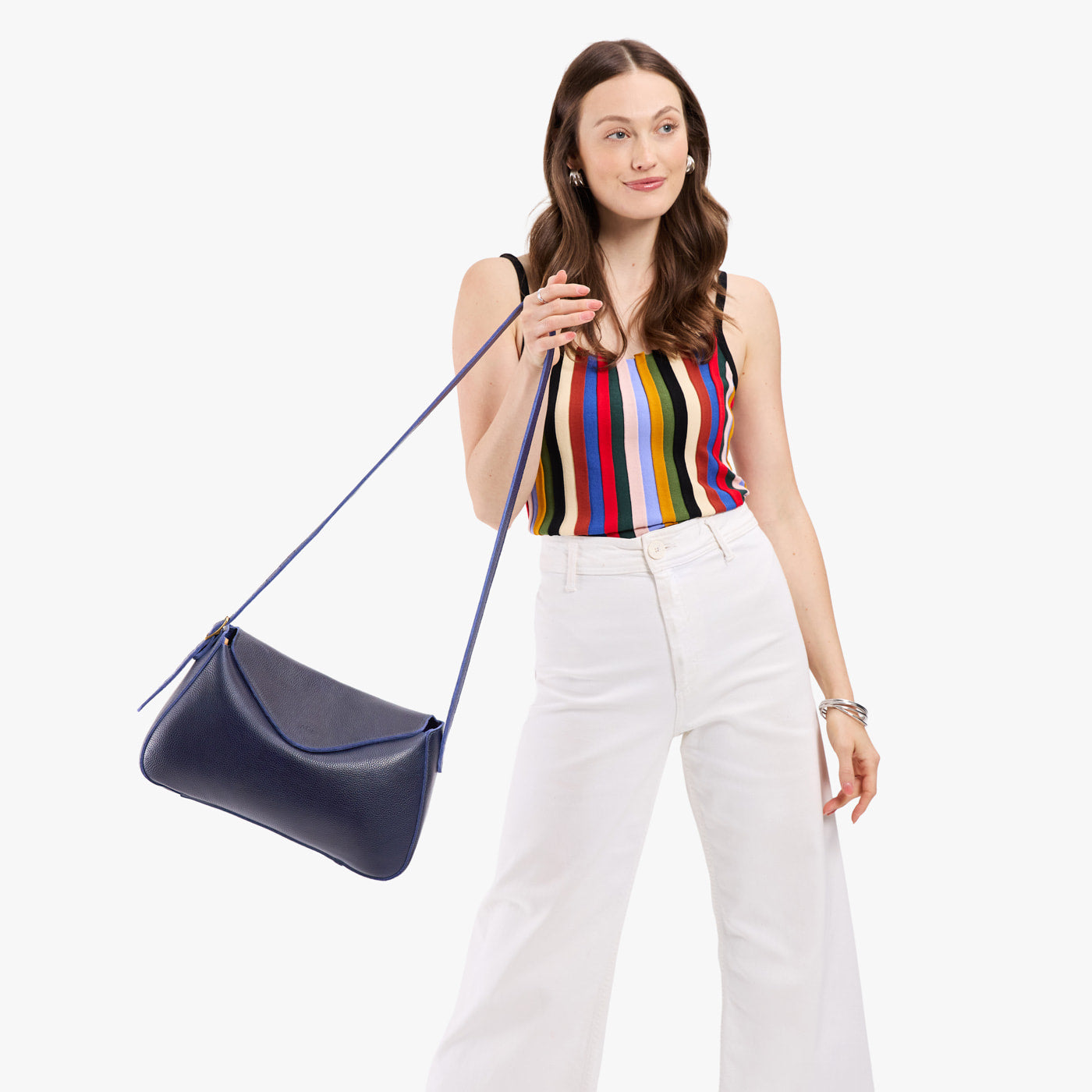 Cobalt*Medium | Model wearing a leather Crossbody with a flap and magnetic closure