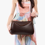 Coldbrew Medium | Model wearing a leather Crossbody with a flap and magnetic closure