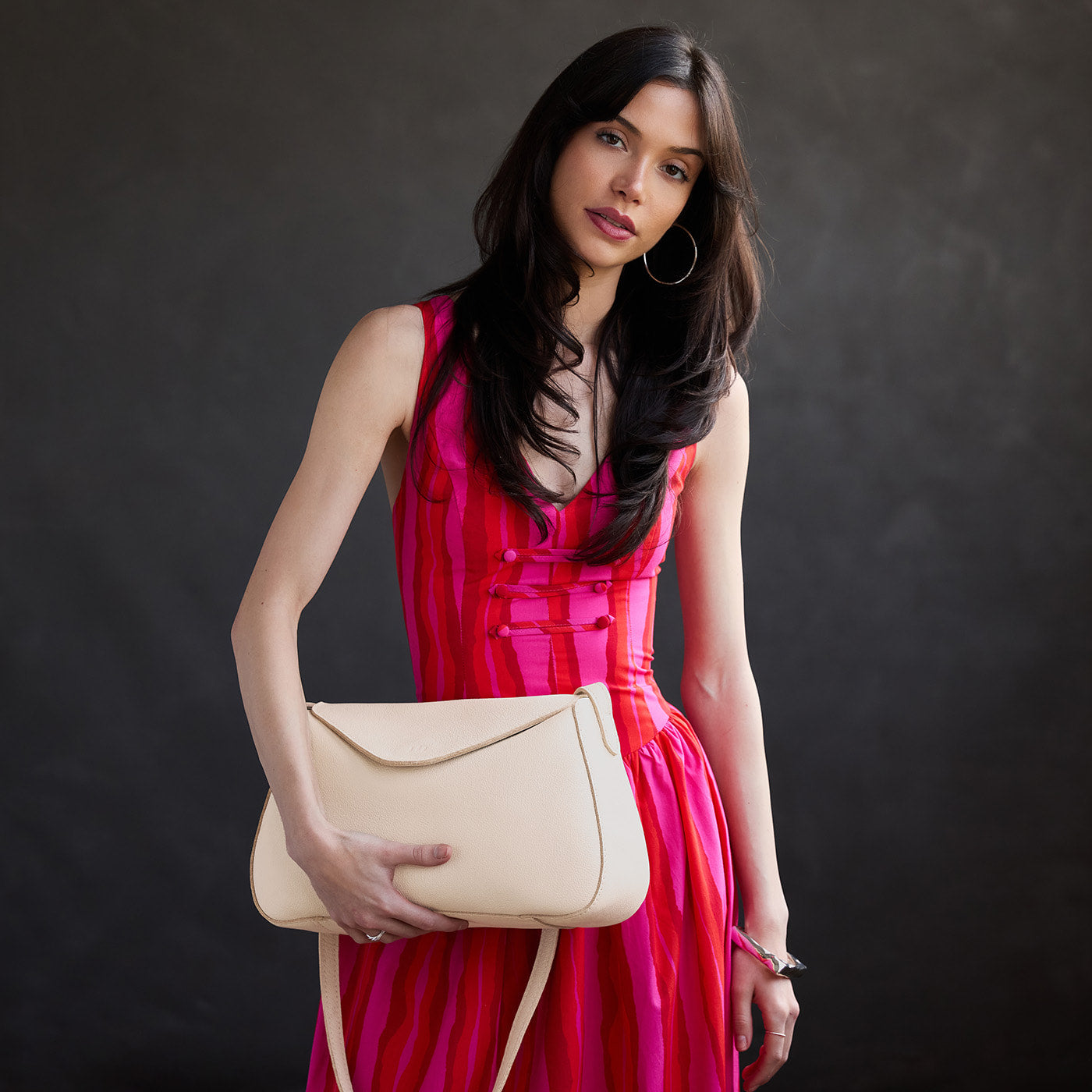 Pebbled Bone*Medium | Model wearing a leather Crossbody with a flap and magnetic closure