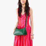 Bacalar Small | Model wearing a leather Crossbody with a flap and magnetic closure