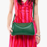 Bacalar Small | Model wearing a leather Crossbody with a flap and magnetic closure