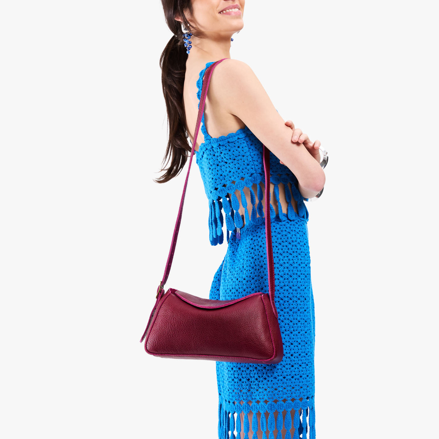 Orchid*Small | Model wearing a leather Crossbody with a flap and magnetic closure