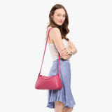 Wild Rose Small | Model wearing a leather Crossbody with a flap and magnetic closure