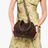 Coldbrew | Model wearing bucket bag with cinched drawstring closure