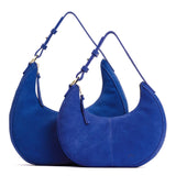 Joni Blue | Crescent shaped shoulder bag with zipper closure and adjustable strap