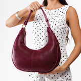 Orchid Large | Crescent shaped shoulder bag with zipper closure and adjustable strap