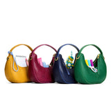 All Variants | crescent shaped shoulder bags with zipper closure and gold accents
