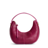 Orchid | Crescent shaped shoulder bag with zipper closure and gold accents