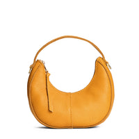 Sunshine | Crescent shaped shoulder bag with zipper closure and gold accents
