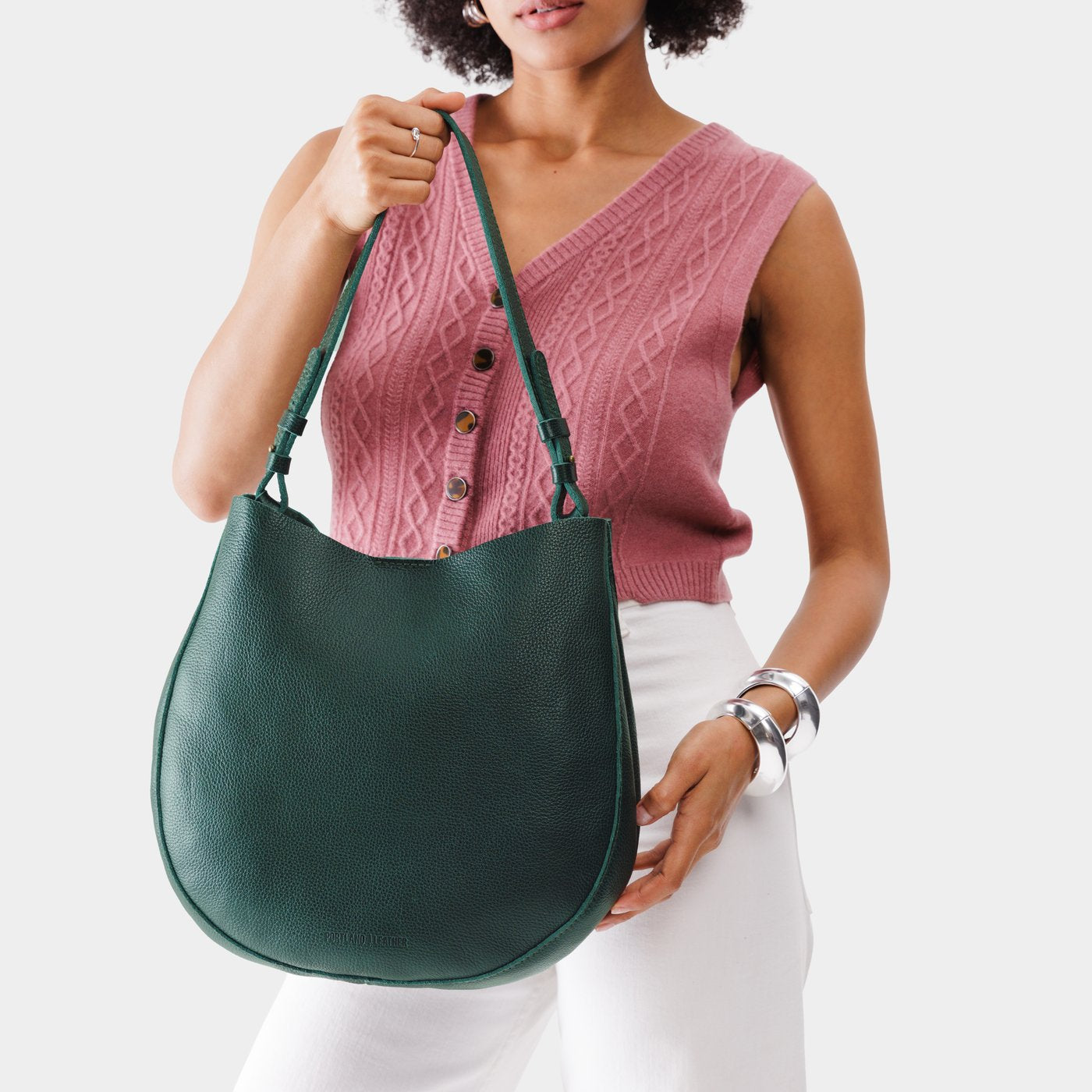 Forest Green*Large | Woman wearing rounded shoulder bag with adjustable strap on a white background