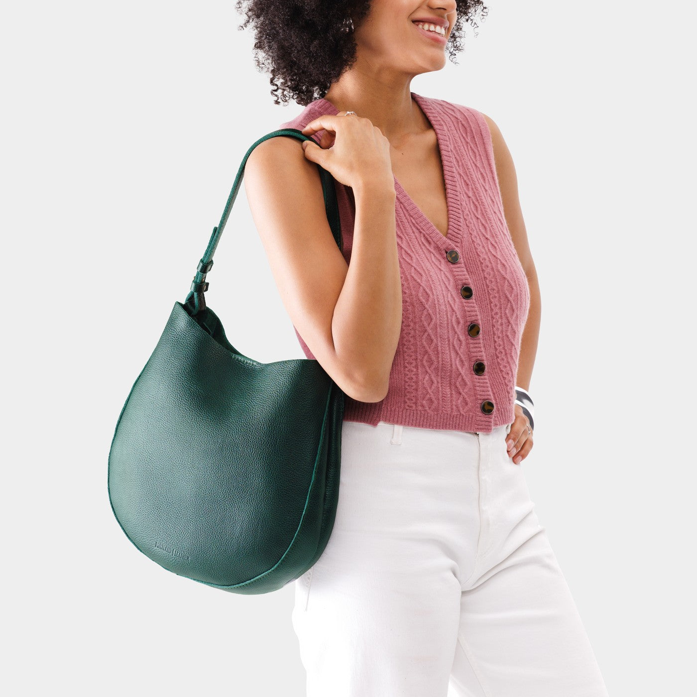 Forest Green*Large | Woman wearing rounded shoulder bag with adjustable strap on a white background