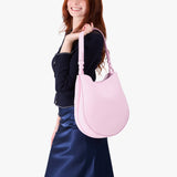 Pinkaboo Large | Model holding round leather purse with adjustable shoulder strap