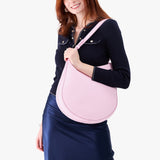 Pinkaboo Large | Model holding round leather purse with adjustable shoulder strap
