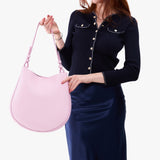 Pinkaboo Large | Model holding round leather purse with adjustable shoulder strap