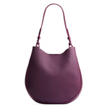 Plum Large | Rounded shoulder bag with adjustable strap on a white background