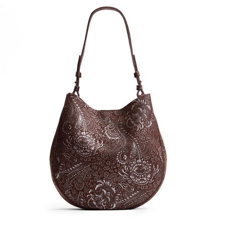 Sepia*Large | Model holding round leather purse with adjustable shoulder strap