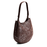 Sepia Large | Model holding round leather purse with adjustable shoulder strap