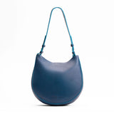 Caspian Medium | Rounded shoulder bag with adjustable strap on a white background