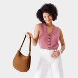 Jackson Medium | Woman wearing rounded shoulder bag with adjustable strap on a white background