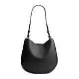 Pebbled--black Medium | Rounded shoulder bag with adjustable strap on a white background