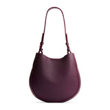 Plum Medium | Rounded shoulder bag with adjustable strap on a white background