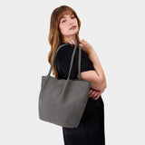 Smoke Grey Oversized | Model holding extra wide bucket shaped tote bag with matching leather handles