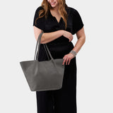 Smoke Grey Oversized | Model holding extra wide bucket shaped tote bag with matching leather handles