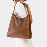 Asheville Oversized | Model wearing large shoulder bag with magnetic snap 