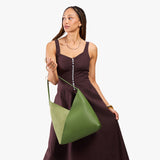 Dryland Green Oversized | Model carrying large shoulder bag with adjustable strap and magnetic snap closure