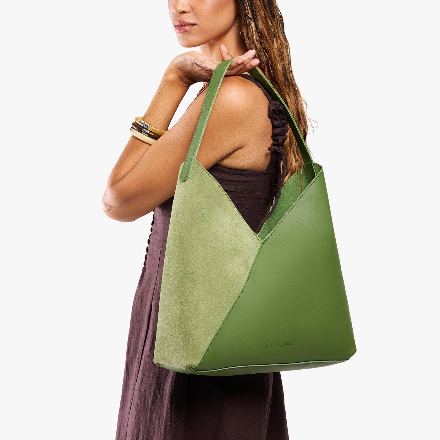 Dryland Green*Oversized | Model wearing large shoulder bag with adjustable strap and magnetic snap closure