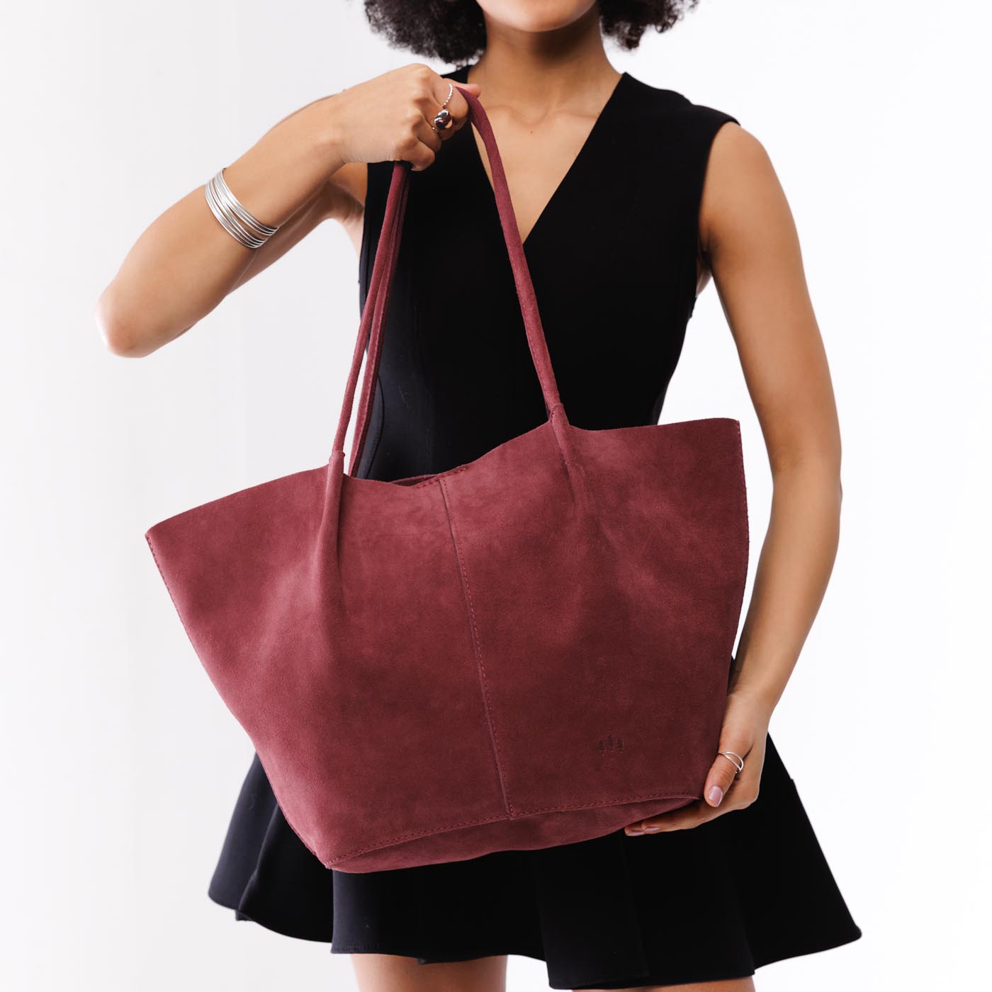Red Panda*Oversized | Model holding extra wide bucket shaped tote bag with matching leather handles