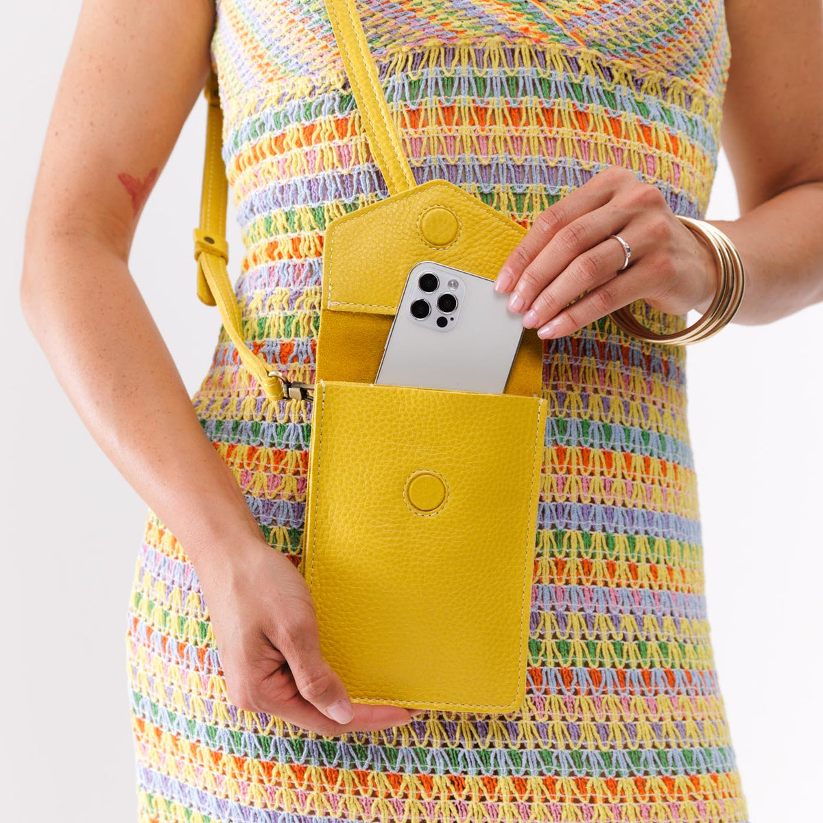 All Variants | Model pulling a smartphone out of a Parker Phone Bag in Naples