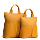 Sunshine | A comparison image of a Large and Small Pembroke Crossbody Clutch