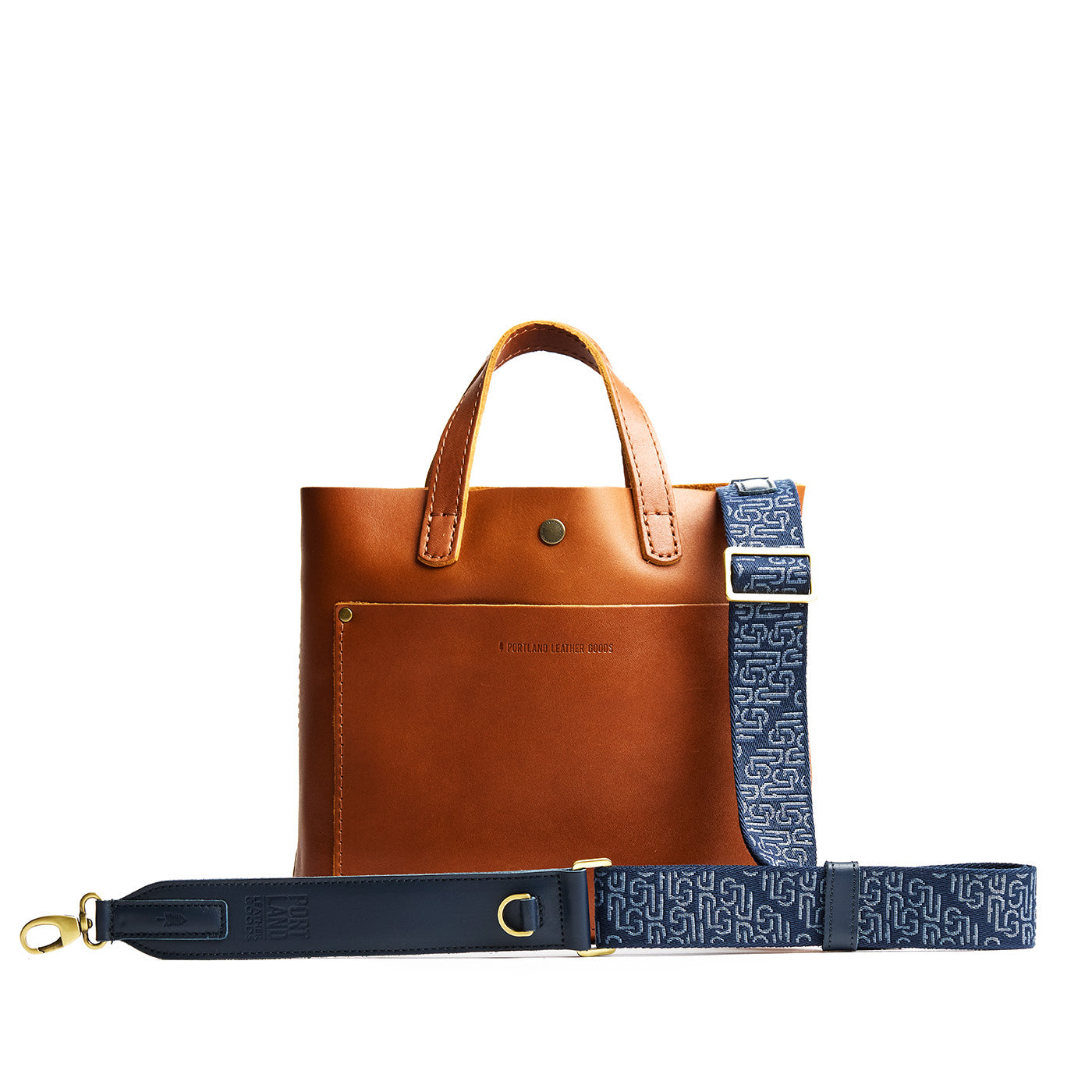 Arctic Depth | Leather and webbing strap with repeating PLG lettering on a leather bag