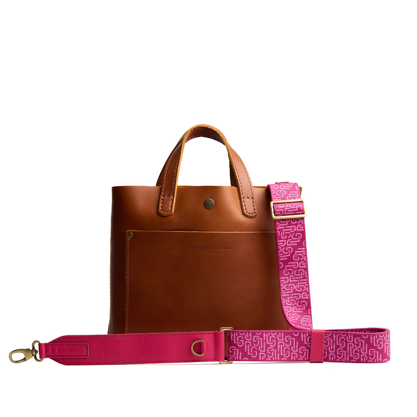Pink Punk | Leather and webbing strap with repeating PLG lettering on a leather bag