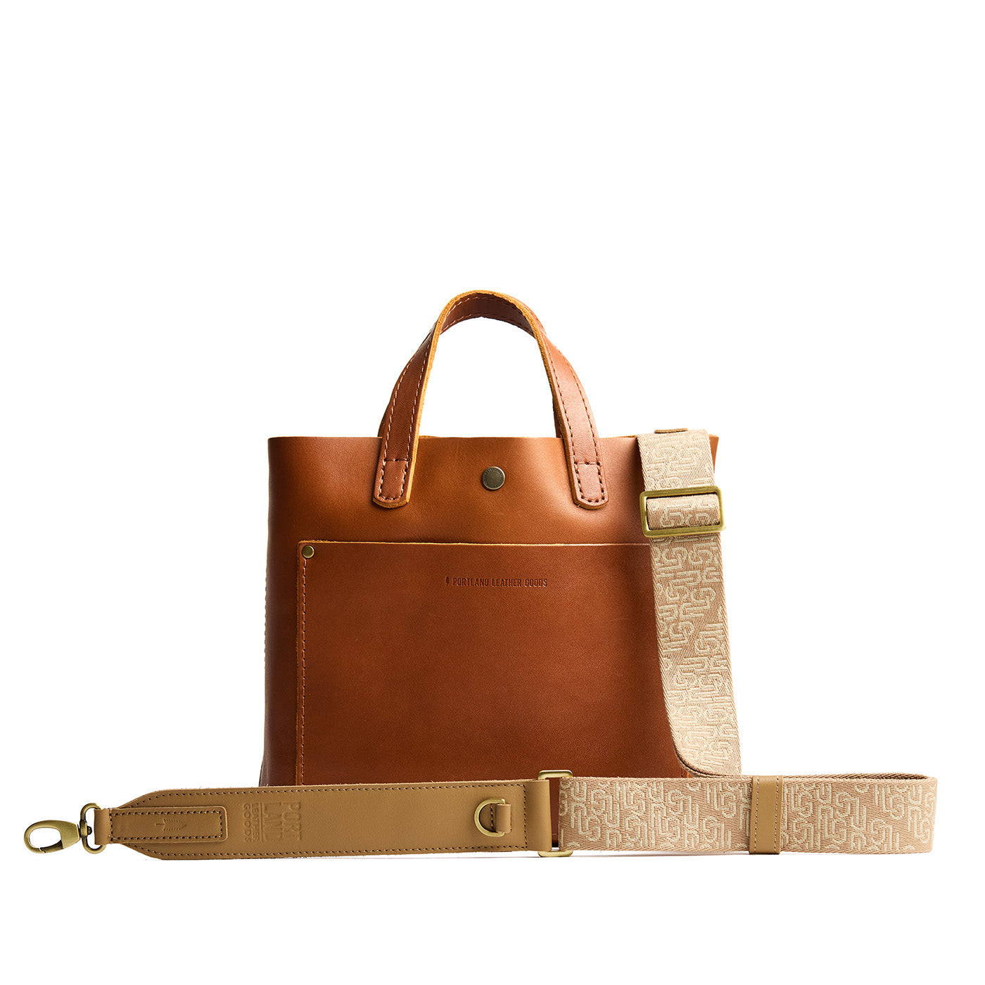 Sahara | Leather and webbing strap with repeating PLG lettering on a leather purse