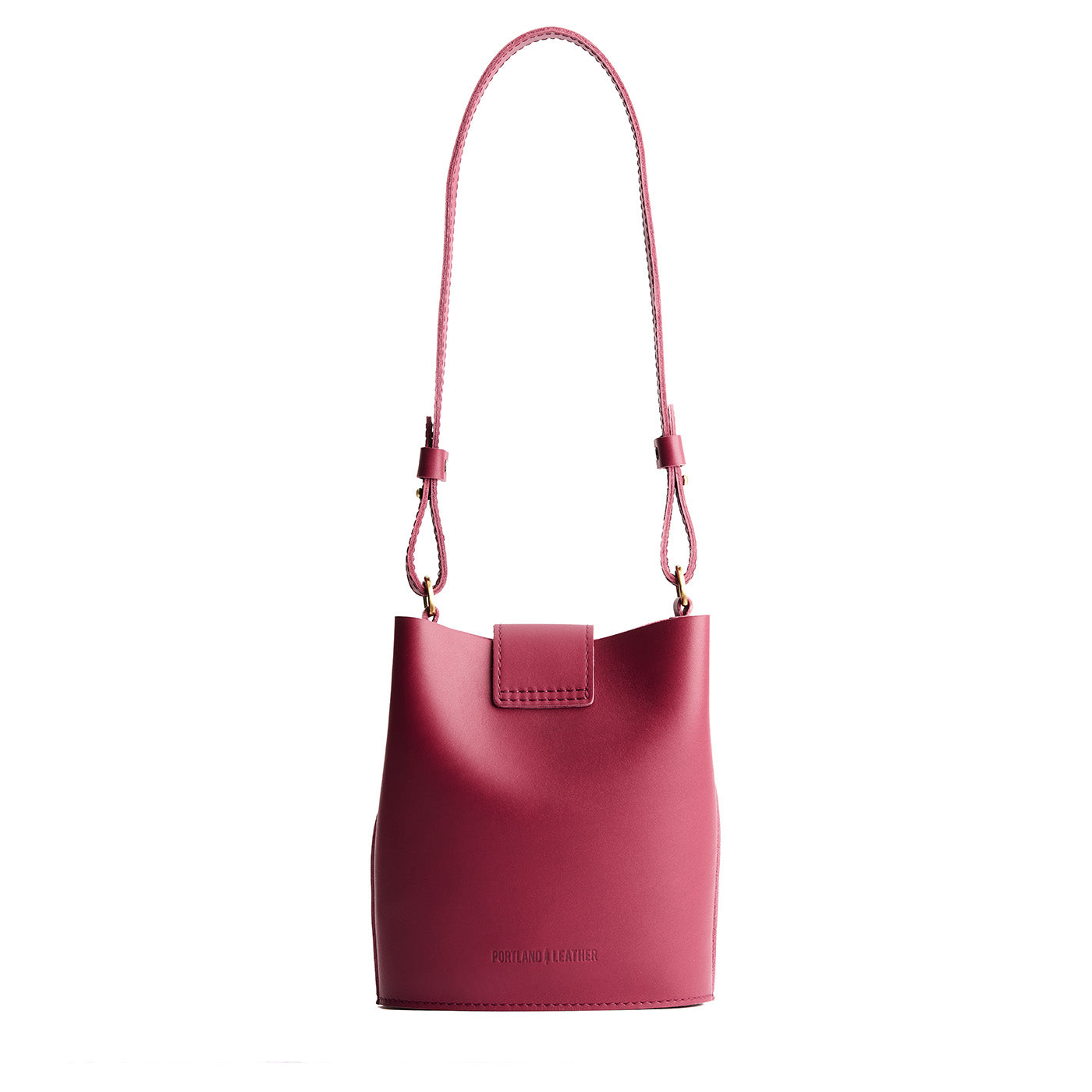 Berry Good | Leather bucket shoulder bag with adjustable strap and magnetic closure on a white background
