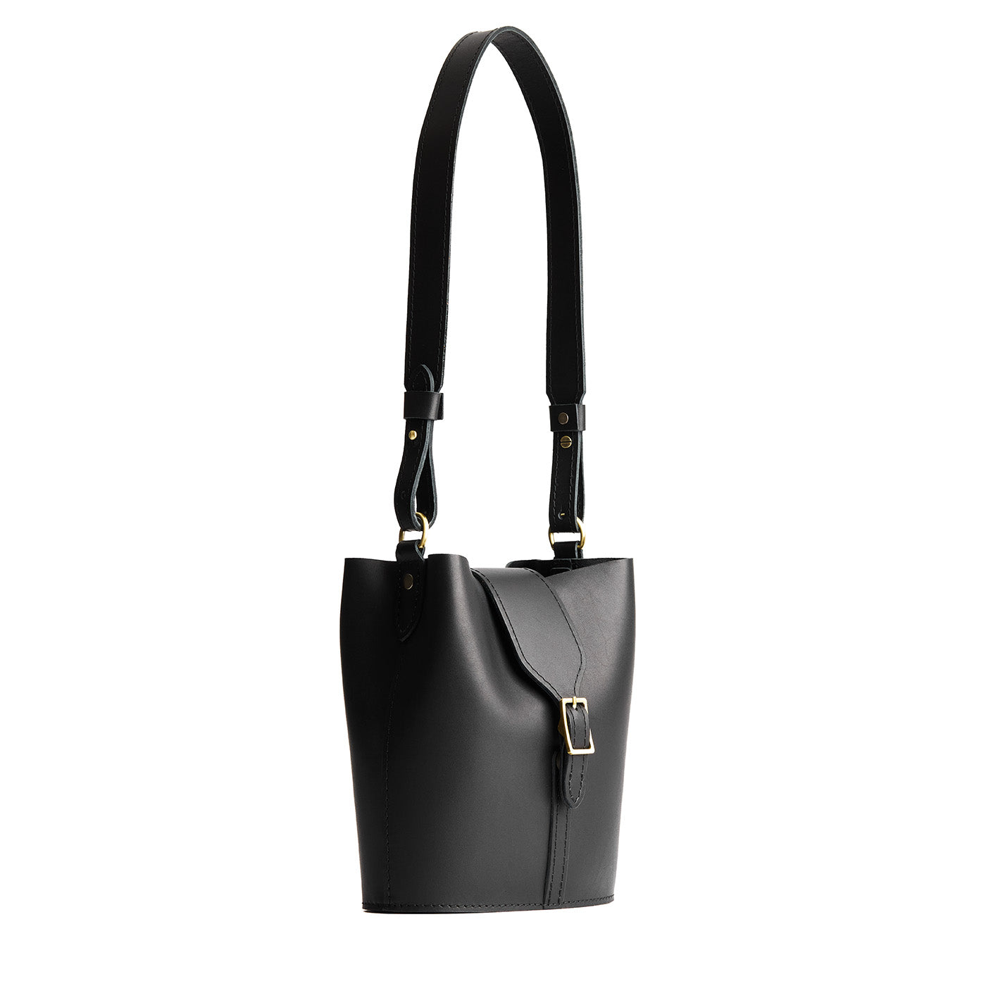 Black | Leather bucket shoulder bag with adjustable strap and magnetic closure on a white background