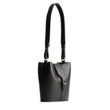 Black | Leather bucket shoulder bag with adjustable strap and magnetic closure on a white background