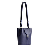 Cobalt | Leather bucket shoulder bag with adjustable strap and magnetic closure on a white background