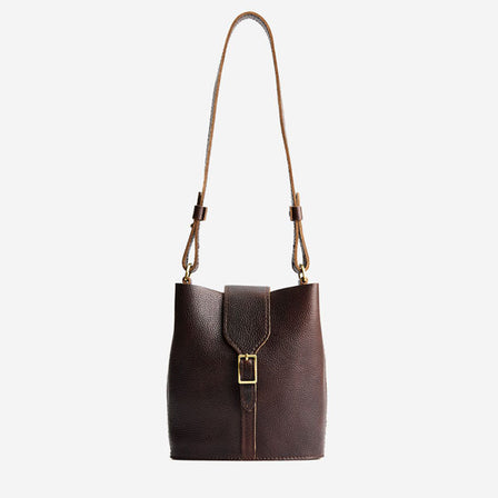 Coldbrew | Leather bucket shoulder bag with adjustable strap and magnetic closure on a white background