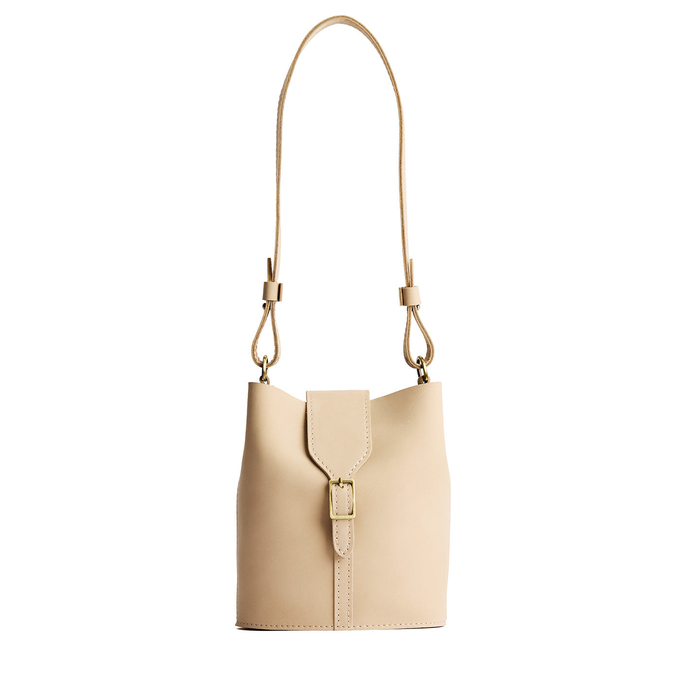 Dragon Bone | Leather bucket shoulder bag with adjustable strap and magnetic closure on a white background