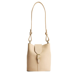 Dragon Bone | Leather bucket shoulder bag with adjustable strap and magnetic closure on a white background