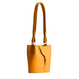 Sunflower | Leather bucket shoulder bag with adjustable strap and magnetic closure on a white background