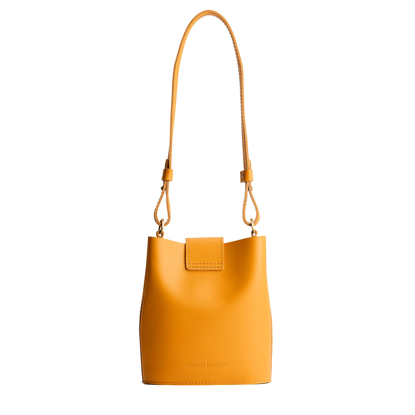 Sunflower | Leather bucket shoulder bag with adjustable strap and magnetic closure on a white background
