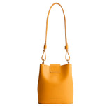 Sunflower | Leather bucket shoulder bag with adjustable strap and magnetic closure on a white background