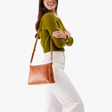 Sienna Large | Model wearing a zip top crossbody bag with detachable strap