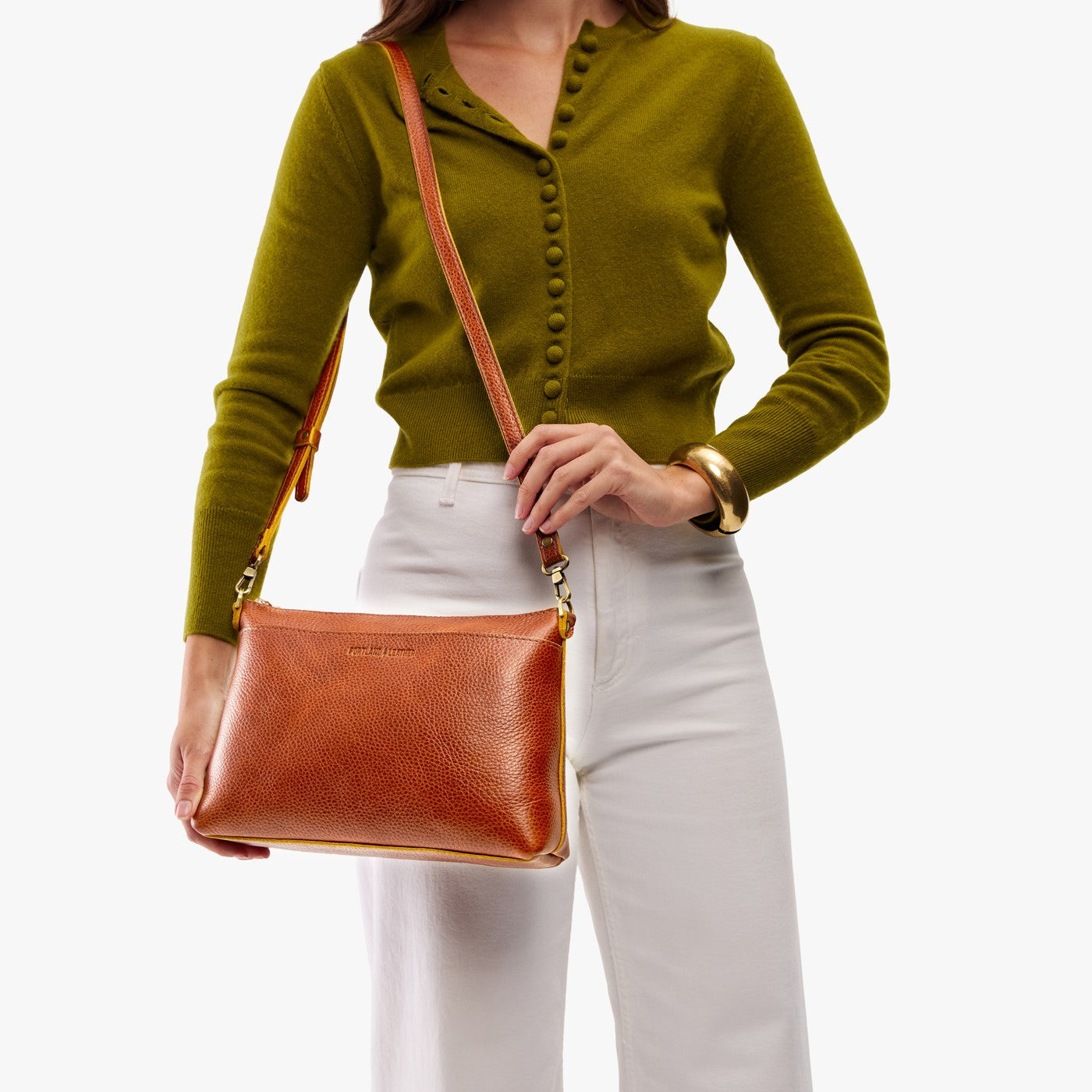 Sienna*Large | Model holding a zip top crossbody bag with detachable strap