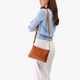 Sienna Classic | Model wearing a zip top crossbody bag with detachable strap